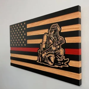 side view of thin red line wood flag with fire firefighter in fire attack position