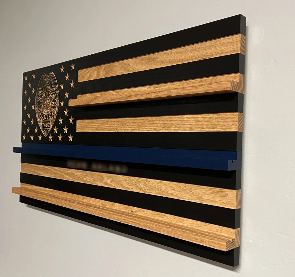 side view of sdpd wood challenge coin flag with badge in the union