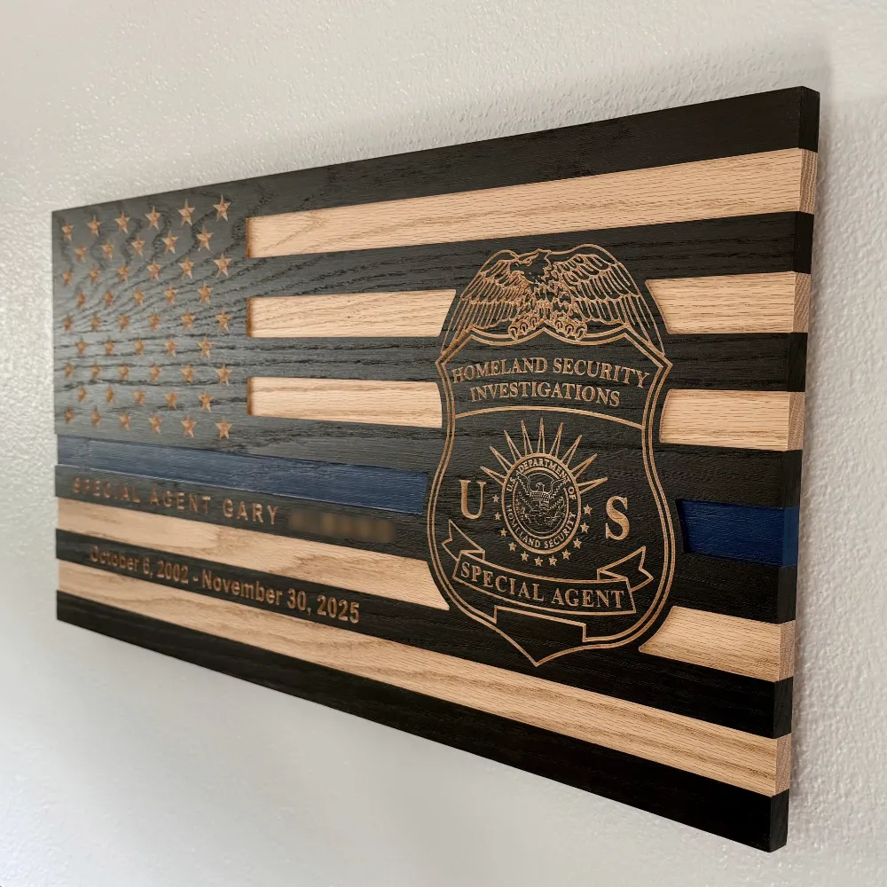 side view of thin blue line wood flag with homeland security investigations (hsi) badge